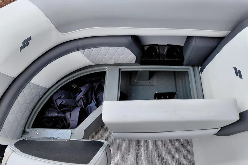 Slide: The Image of Interior of 2026 Starcraft EXS 1 Q DH boat with storage compartment and seating. - 21