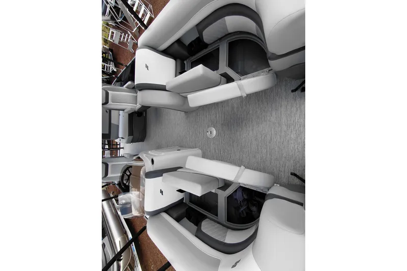 Slide: The Image of Interior view of 2026 Starcraft EXS 1 Q DH boat with modern seating layout. - 22
