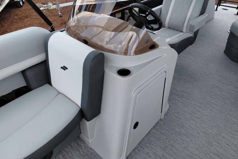 Slide: The Image of 2026 Starcraft EXS 1 Q DH boat interior with modern seating and steering console. - 23