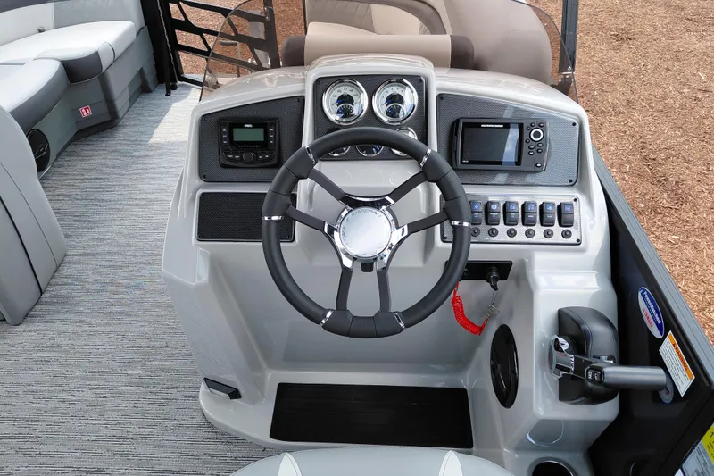 Slide: The Image of 2026 Starcraft EXS 1 Q DH boat dashboard with steering wheel and control panel. - 24