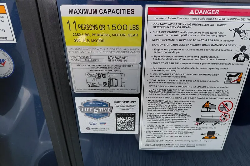Slide: The Image of Starcraft EXS 1 Q DH 2026 boat capacity and safety warnings label. - 26