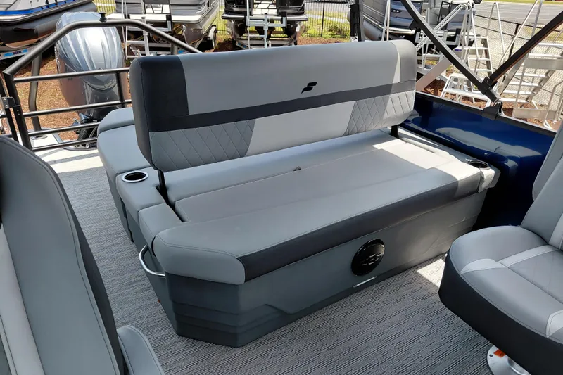 Slide: The Image of 2026 Starcraft EXS 1 Q DH boat interior with gray seating and cup holders. - 29