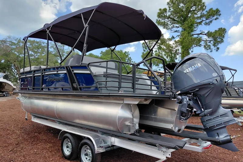 Slide: The Image of 2026 Starcraft EXS 1 Q DH pontoon boat with Yamaha engine on trailer. - 3