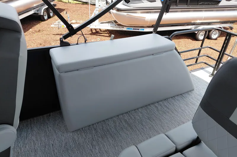 Slide: The Image of 2026 Starcraft EXS 1 Q DH boat interior with gray seating and flooring. - 30
