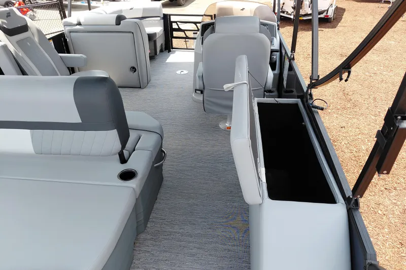 Slide: The Image of Interior of 2026 Starcraft EXS 1 Q DH boat with gray seating and storage compartments. - 31