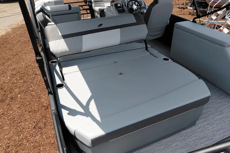 Slide: The Image of 2026 Starcraft EXS 1 Q DH boat interior with gray seating and cup holders. - 34
