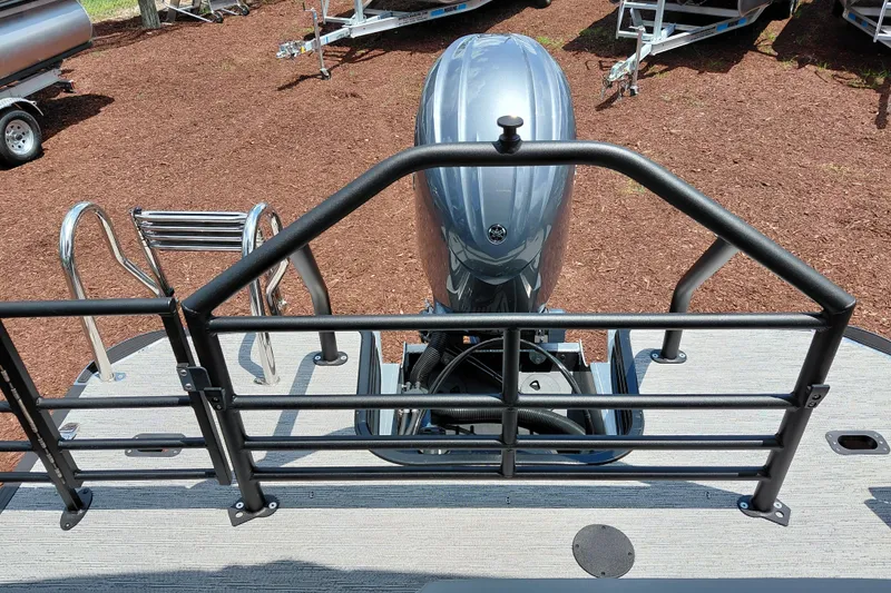 Slide: The Image of 2026 Starcraft EXS 1 Q DH boat with motor and ladder, displayed outdoors. - 35