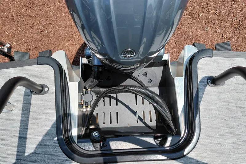 Slide: The Image of Top view of 2026 Starcraft EXS 1 Q DH boat engine compartment with cables and controls. - 36