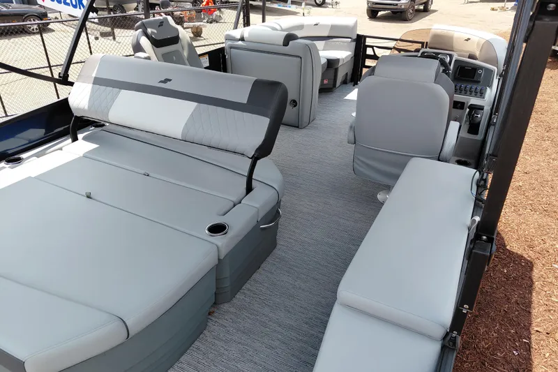 Slide: The Image of 2026 Starcraft EXS 1 Q DH boat interior with gray seating and modern dashboard. - 37