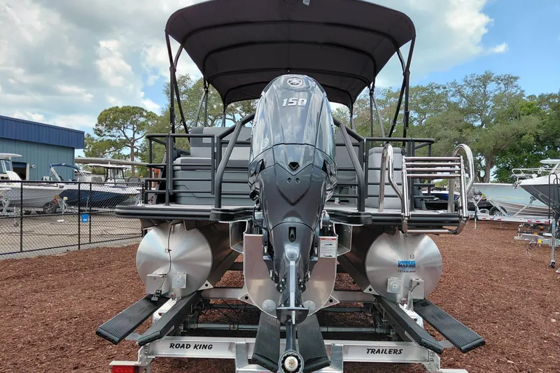 Slide: The Image of 2026 Starcraft EXS 1 Q DH pontoon boat with Yamaha 150 engine on trailer. - 4