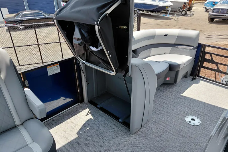 Slide: The Image of 2026 Starcraft EXS 1 Q DH boat interior with gray seating and carpeted floor. - 40