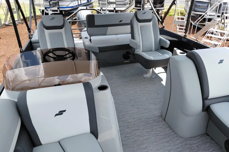 Slide: The Image of Interior of 2026 Starcraft EXS 1 Q DH boat with modern seating and steering wheel. - 42
