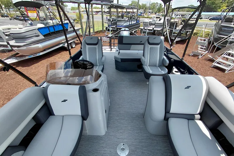 Slide: The Image of Interior of 2026 Starcraft EXS 1 Q DH pontoon boat with modern seating and helm. - 43