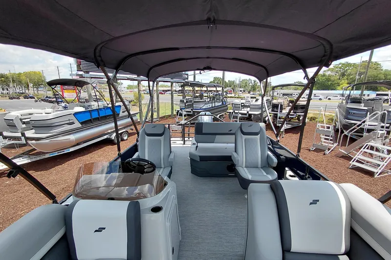 Slide: The Image of 2026 Starcraft EXS 1 Q DH pontoon boat interior with seating and canopy. - 44