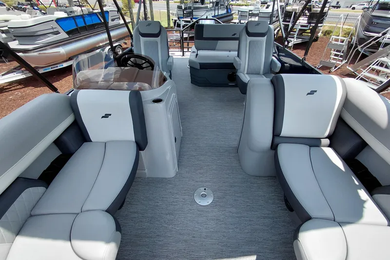 Slide: The Image of 2026 Starcraft EXS 1 Q DH pontoon boat interior with gray seating and steering console. - 45