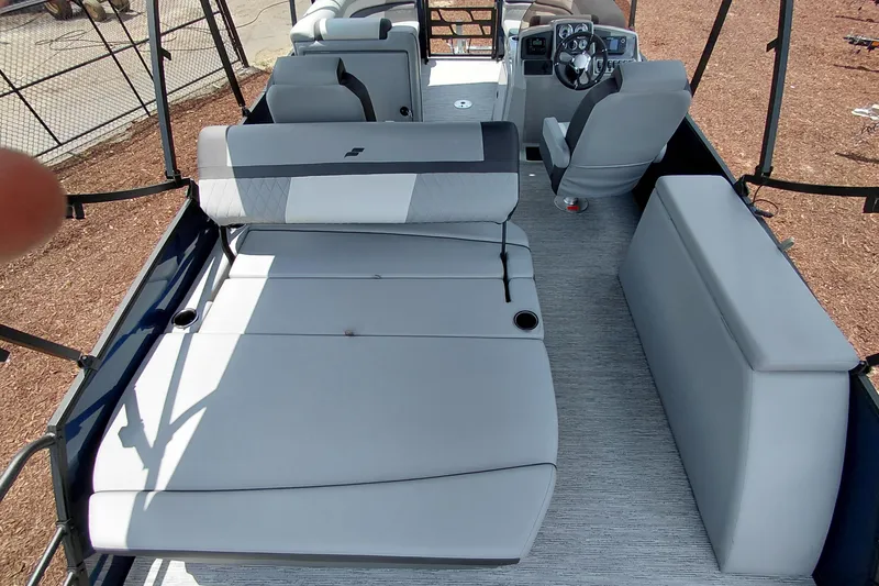 Slide: The Image of 2026 Starcraft EXS 1 Q DH boat interior with gray seating and steering console. - 46