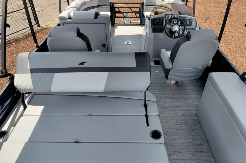 Slide: The Image of Interior of 2026 Starcraft EXS 1 Q DH boat with modern seating and steering console. - 47
