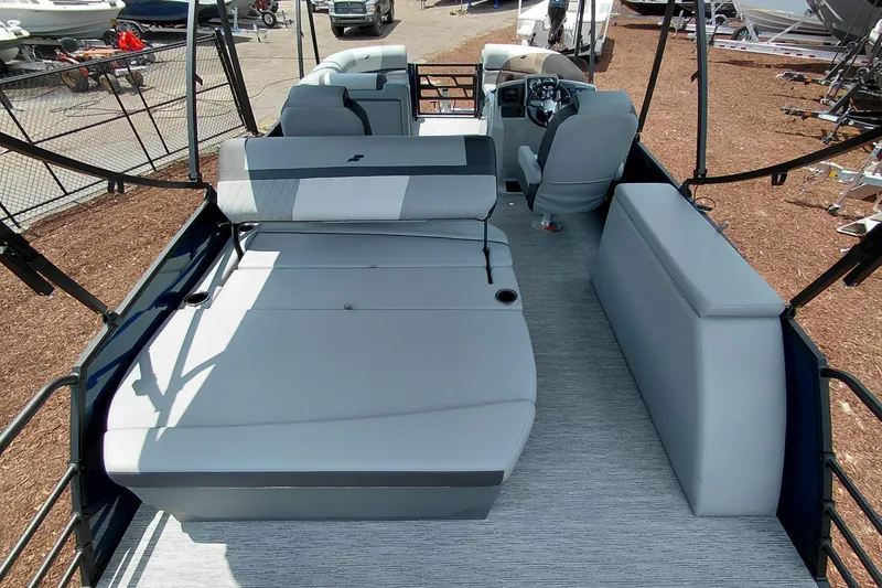 Slide: The Image of 2026 Starcraft EXS 1 Q DH boat interior with modern seating and steering console. - 48