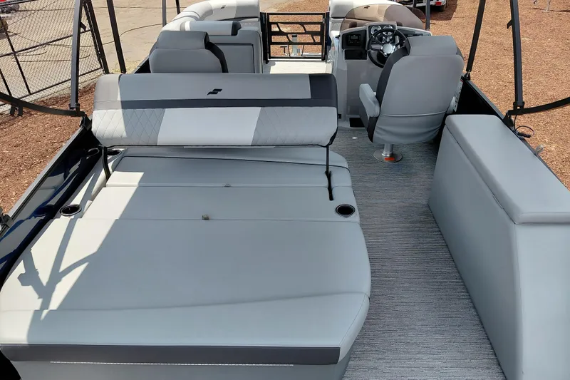 Slide: The Image of 2026 Starcraft EXS 1 Q DH boat interior with spacious seating and modern helm. - 49