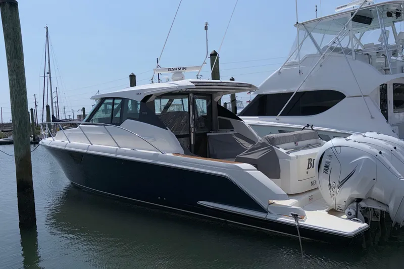 The Image of 2022 Tiara Yachts 43 LE docked, showcasing sleek design and powerful engines. - 0