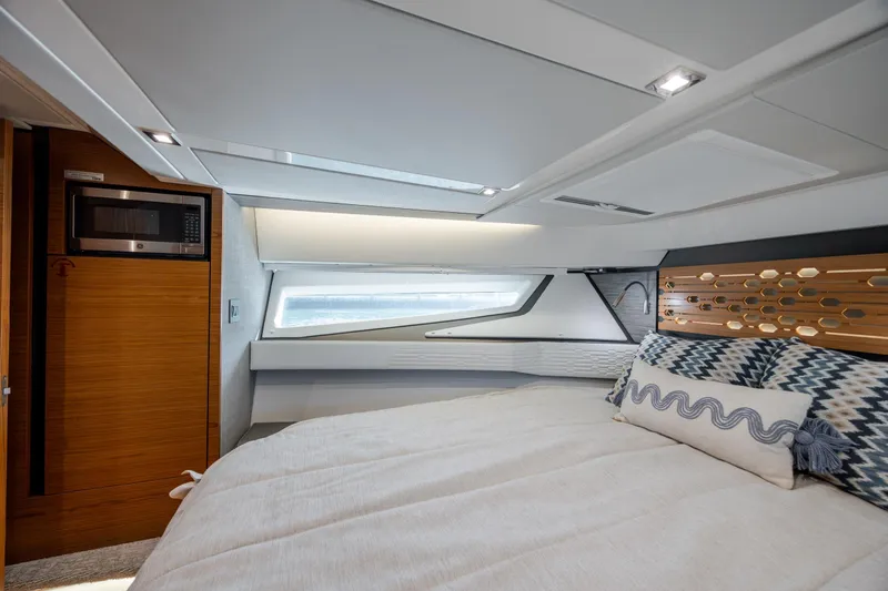 Slide: The Image of Luxurious interior cabin of 2022 Tiara Yachts 43 LE with modern design and cozy bedding. - 14