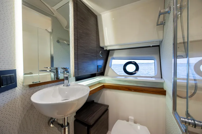 Slide: The Image of Luxurious bathroom interior of 2022 Tiara Yachts 43 LE, featuring modern fixtures and ocean view. - 18