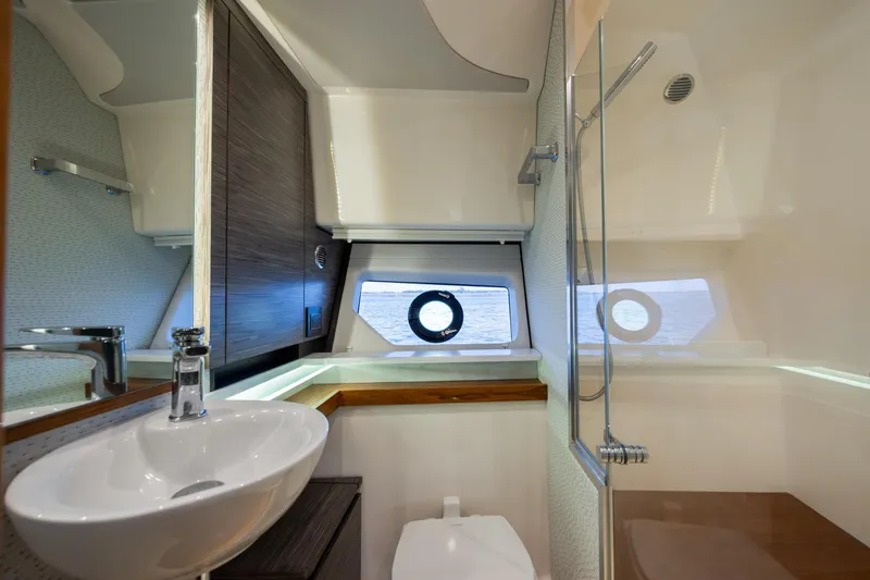 Slide: The Image of Luxurious bathroom interior of 2022 Tiara Yachts 43 LE with modern fixtures and ocean view. - 19