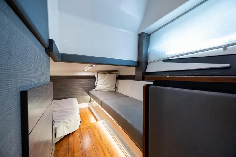 Slide: The Image of Luxurious interior cabin of 2022 Tiara Yachts 43 LE with modern design and cozy bedding. - 24