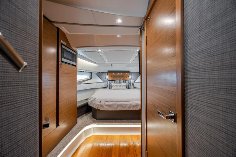 Slide: The Image of Luxurious interior of 2022 Tiara Yachts 43 LE, featuring a cozy bedroom with modern design. - 28
