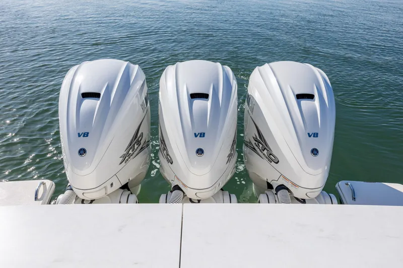 Slide: The Image of Triple Yamaha V8 outboard engines on a 2022 Tiara Yachts 43 LE in water. - 31
