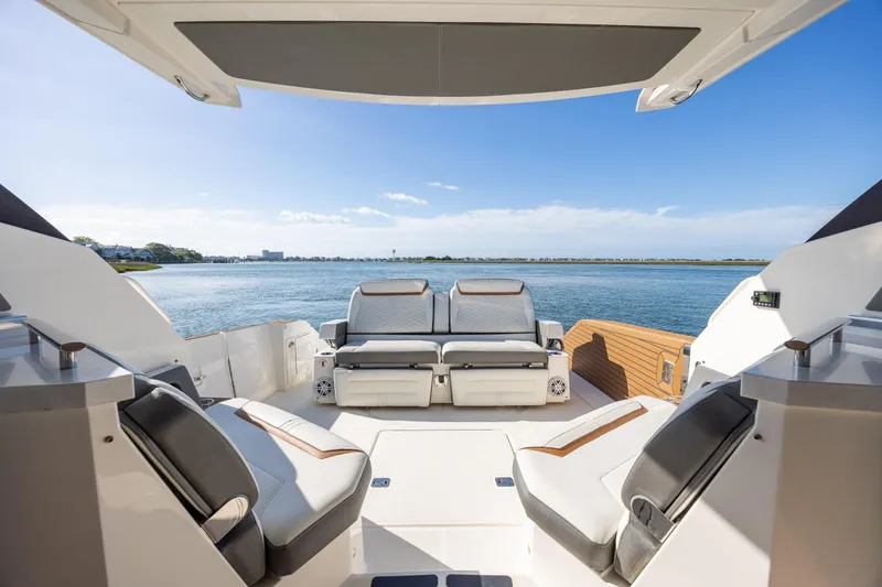 Slide: The Image of 2022 Tiara Yachts 43 LE interior with luxurious seating and scenic water view. - 37
