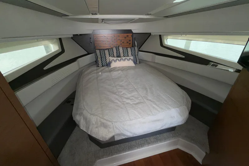 Slide: The Image of Luxurious cabin interior of 2022 Tiara Yachts 43 LE with cozy bedding and modern design. - 4