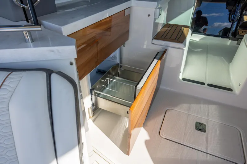 Slide: The Image of 2022 Tiara Yachts 43 LE interior with open storage compartment and sleek design. - 42