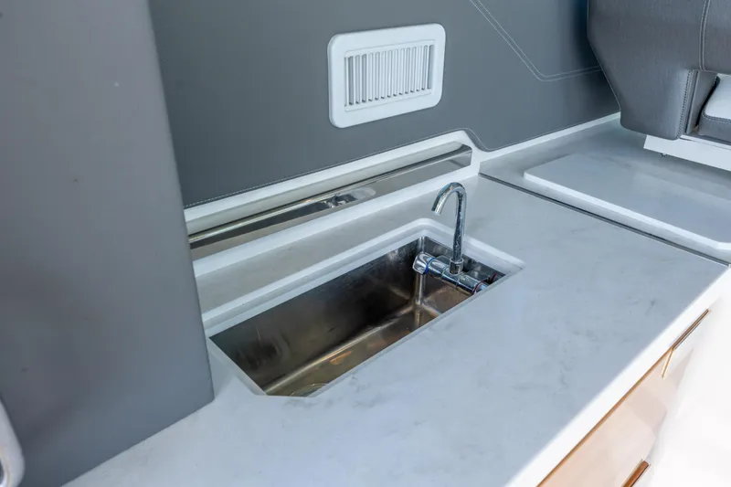 Slide: The Image of Modern sink area on 2022 Tiara Yachts 43 LE, featuring sleek countertop design. - 43