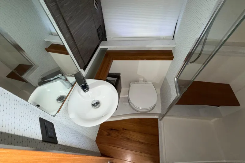 Slide: The Image of Bathroom interior of 2022 Tiara Yachts 43 LE, featuring sink and toilet. - 5
