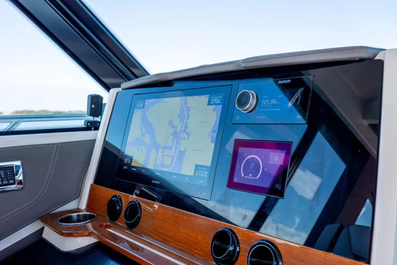 Slide: The Image of Dashboard of 2022 Tiara Yachts 43 LE featuring advanced navigation and control displays. - 52