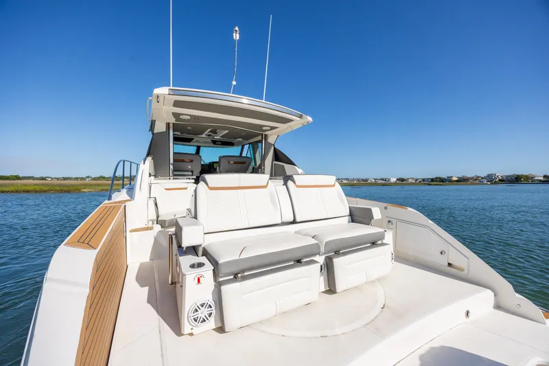Slide: The Image of 2022 Tiara Yachts 43 LE luxury boat with spacious seating on calm water. - 55