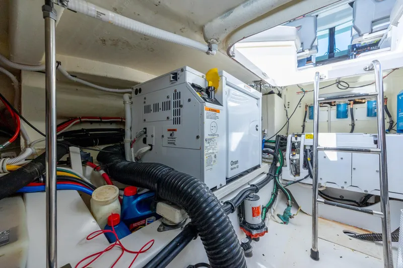 Slide: The Image of Engine room of 2022 Tiara Yachts 43 LE with Onan generator and wiring. - 62