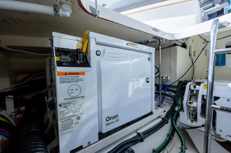 Slide: The Image of Engine room of 2022 Tiara Yachts 43 LE with Onan Marine generator. - 64