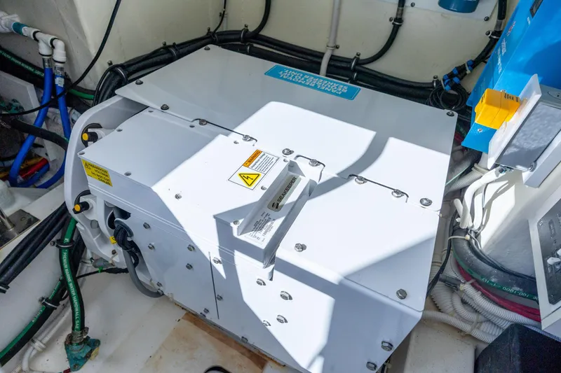 Slide: The Image of Engine compartment of 2022 Tiara Yachts 43 LE, showcasing electrical components and wiring. - 65