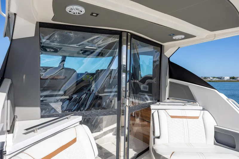 Slide: The Image of 2022 Tiara Yachts 43 LE interior with sleek seating and glass doors. - 68