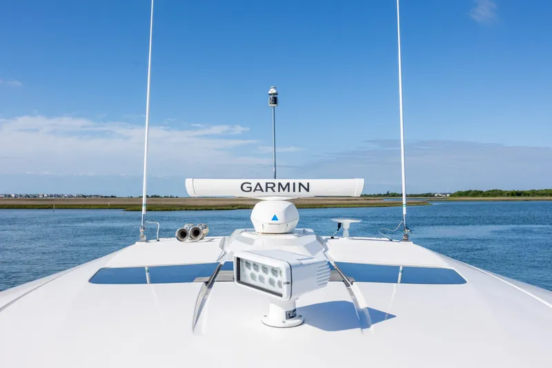 Slide: The Image of 2022 Tiara Yachts 43 LE with Garmin radar on calm water. - 72