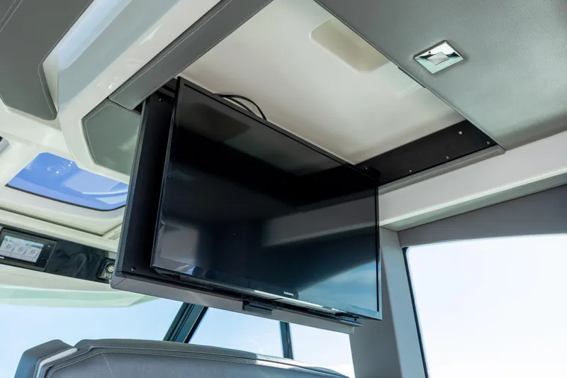 Slide: The Image of 2022 Tiara Yachts 43 LE interior with mounted TV screen. - 73