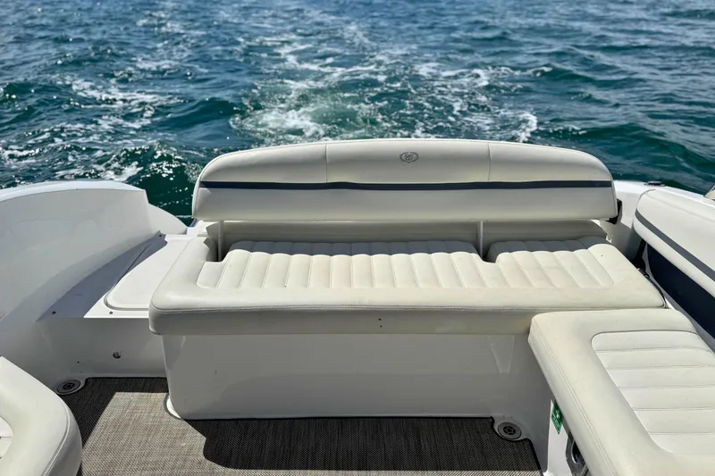 Slide: The Image of 2016 Cobalt R5 boat interior with white seating, cruising on open water. - 10