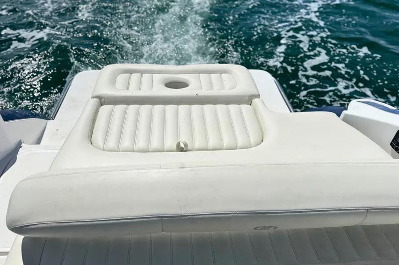 Slide: The Image of Rear view of 2016 Cobalt R5 boat with white seating and ocean backdrop. - 11
