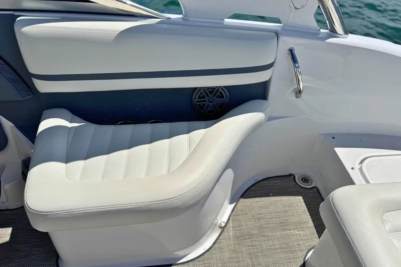 Slide: The Image of 2016 Cobalt R5 boat interior with white leather seating and stainless steel handle. - 12
