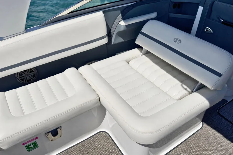 Slide: The Image of Luxurious white seating on a 2016 Cobalt R5 boat, featuring sleek design and comfort. - 15