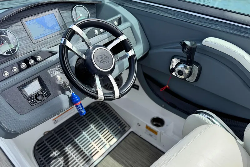 Slide: The Image of Interior view of 2016 Cobalt R5 boat dashboard with steering wheel and controls. - 18