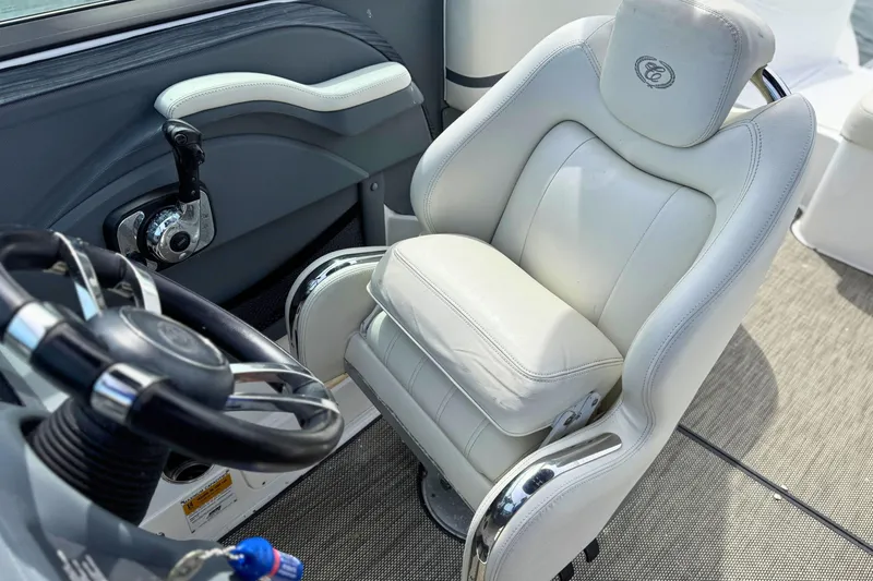 Slide: The Image of Luxury white captain's chair and steering wheel in 2016 Cobalt R5 boat cockpit. - 19
