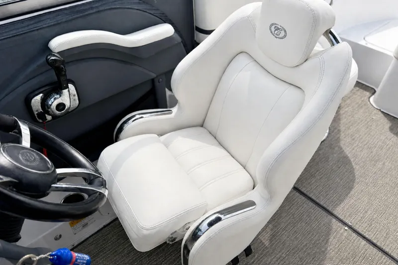 Slide: The Image of Luxurious white captain's chair in a 2016 Cobalt R5 boat cockpit. - 20